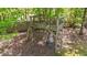 Wooden treehouse in wooded area with ladder and safety railings at 3308 Eden Grove Rd, Fuquay Varina, NC 27526
