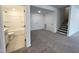 Finished basement featuring a bathroom, storage closets, and a convenient staircase at 4408 Emeline Way # 34, Fuquay Varina, NC 27526