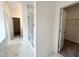Bathroom featuring walk-in closet, glass shower and vanity with marble floors at 4408 Emeline Way # 34, Fuquay Varina, NC 27526