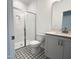 Modern bathroom featuring a glass-enclosed shower, patterned tile flooring, and a contemporary vanity at 4408 Emeline Way # 34, Fuquay Varina, NC 27526