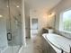 Luxurious bathroom with marble shower, soaking tub, and double vanity sinks at 4408 Emeline Way # 34, Fuquay Varina, NC 27526