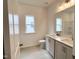 Bathroom featuring double vanity, ample counter space, and a large mirror at 4408 Emeline Way # 34, Fuquay Varina, NC 27526