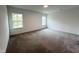 Well-lit carpeted bedroom featuring large windows offering ample natural light and pleasant views at 4408 Emeline Way # 34, Fuquay Varina, NC 27526