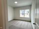 Bedroom showcasing neutral carpeting, a large window, and ample natural light at 4408 Emeline Way # 34, Fuquay Varina, NC 27526