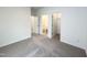 Bright bedroom showing multiple doors with ensuite bathroom and walk-in closet at 4408 Emeline Way # 34, Fuquay Varina, NC 27526