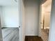 Hallway featuring views into a bathroom and bedroom, showcasing the home's layout and design at 4408 Emeline Way # 34, Fuquay Varina, NC 27526