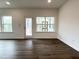 Bright living space with large windows and a door leading to the outside at 4408 Emeline Way # 34, Fuquay Varina, NC 27526