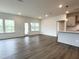 Open living space with large windows and a door leading to outdoor area, filled with natural light at 4408 Emeline Way # 34, Fuquay Varina, NC 27526