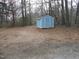 Backyard with shed and gravel parking area at 512 E Branch St, Spring Hope, NC 27882
