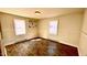 Cozy bedroom with hardwood floors, neutral walls, and natural light at 512 E Branch St, Spring Hope, NC 27882