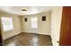 Bright bedroom with laminate floors, neutral paint and two windows for natural light at 512 E Branch St, Spring Hope, NC 27882