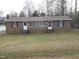 Front view of a brick duplex with two units and a grassy yard at 512 E Branch St, Spring Hope, NC 27882