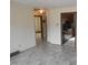 View of hallway showing access to other rooms and kitchen at 512 E Branch St, Spring Hope, NC 27882