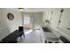 Bright kitchen area with neutral cabinets, natural light and space for dining at 512 E Branch St, Spring Hope, NC 27882