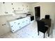 Bright kitchen features white cabinets, and a dining area at 512 E Branch St, Spring Hope, NC 27882