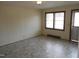 Living room with light walls, wood-paneled baseboards, and vinyl flooring at 512 E Branch St, Spring Hope, NC 27882
