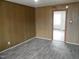 Living room with wood-look floors and an open doorway at 512 E Branch St, Spring Hope, NC 27882