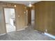 Living room with wood-look floors and view of kitchen at 512 E Branch St, Spring Hope, NC 27882
