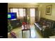 Living room with leather couch, coffee table, and Christmas tree at 512 E Branch St, Spring Hope, NC 27882