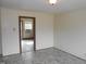 Spacious living room with wood-look floors and an open doorway at 512 E Branch St, Spring Hope, NC 27882