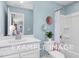Clean bathroom with white vanity and bathtub shower combo at 54 Cultivator Ct, Angier, NC 27501