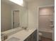 Bathroom featuring double sinks, white quartz countertops, and gray cabinets at 54 Cultivator Ct, Angier, NC 27501