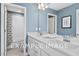Bathroom with double vanity, white cabinets, and a shower/tub combo at 54 Cultivator Ct, Angier, NC 27501
