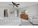 Cozy bedroom featuring a comfortable bed, wooden dresser, and plenty of natural light at 54 Cultivator Ct, Angier, NC 27501