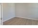 Minimalist bedroom with hardwood floors, neutral walls, and ample natural light at 54 Cultivator Ct, Angier, NC 27501