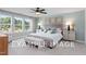 Spacious bedroom with large windows, plush bedding, and ample natural light at 54 Cultivator Ct, Angier, NC 27501
