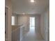 Second floor hallway featuring carpet and white trim at 54 Cultivator Ct, Angier, NC 27501