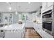 Modern kitchen with island and stainless steel appliances at 54 Cultivator Ct, Angier, NC 27501
