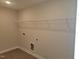 Laundry room with white wire shelving and tile flooring at 54 Cultivator Ct, Angier, NC 27501