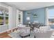 Spacious home office with blue accent wall and hardwood floors at 54 Cultivator Ct, Angier, NC 27501