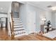 Elegant staircase with wooden handrail and modern design at 54 Cultivator Ct, Angier, NC 27501