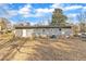 Backyard featuring home with a large yard and mature trees at 704 Sunnybrook Rd, Raleigh, NC 27610