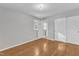 Neutral bedroom with hardwood floors, closet, and natural light at 704 Sunnybrook Rd, Raleigh, NC 27610