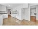 Bright kitchen featuring an electric range, white cabinets, ample counter space and an open floorplan at 704 Sunnybrook Rd, Raleigh, NC 27610
