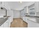 Bright kitchen with white cabinets and countertops at 704 Sunnybrook Rd, Raleigh, NC 27610