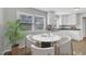 Bright eat-in kitchen featuring a table, white cabinetry and lots of natural light from the window at 704 Sunnybrook Rd, Raleigh, NC 27610