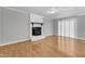 Living room with a wood burning fireplace and ample natural light at 704 Sunnybrook Rd, Raleigh, NC 27610