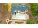 A bird's eye view of the property, showing its layout with a pool, deck, and the surrounding yard at 72 Beverly Dr, Durham, NC 27707
