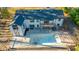 Home with pool and deck; aerial view at 72 Beverly Dr, Durham, NC 27707