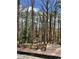 Elevated deck overlooks a wooded backyard, offering peaceful views at 72 Beverly Dr, Durham, NC 27707