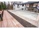 A view of a spacious backyard featuring a partially finished pool, wooden deck, and modern home design at 72 Beverly Dr, Durham, NC 27707