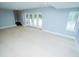 Spacious finished basement with walkout access to the pool and hot tub, plus large window to outside at 72 Beverly Dr, Durham, NC 27707