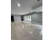 Finished basement with hardwood floors and sliding glass doors at 72 Beverly Dr, Durham, NC 27707