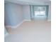 Expansive finished basement with walkout access to pool area offers ample space for recreation and relaxation at 72 Beverly Dr, Durham, NC 27707