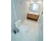 Bathroom features marble tile floors, a wood vanity, and a modern mirror at 72 Beverly Dr, Durham, NC 27707