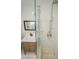 Modern bathroom with sleek glass shower door, stone floor and stylish vanity offers contemporary luxury at 72 Beverly Dr, Durham, NC 27707